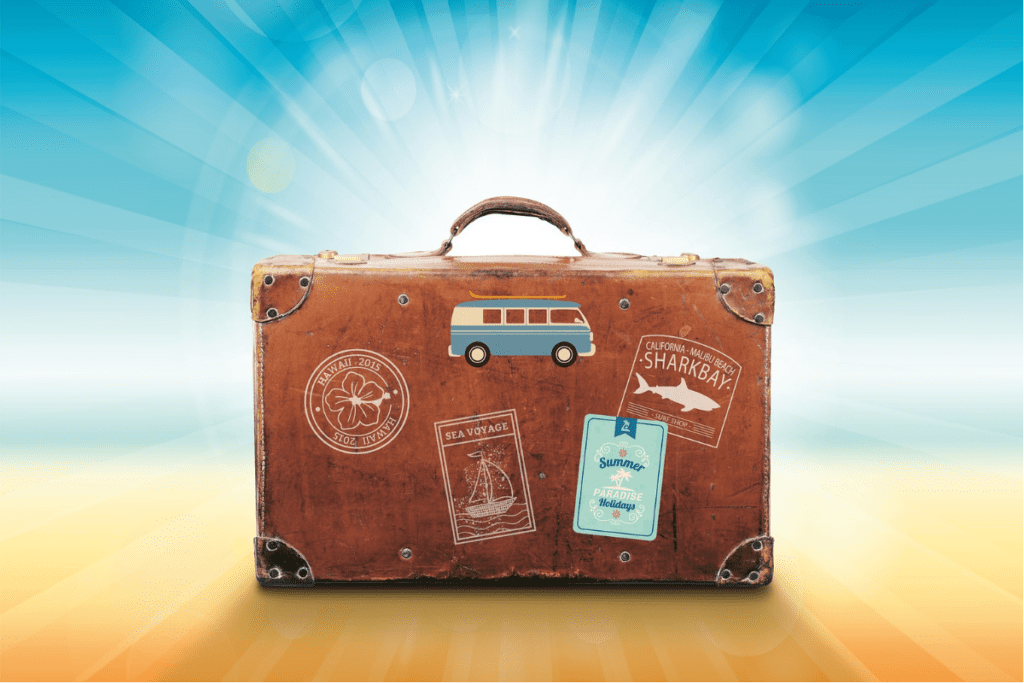 Brown suitcase with bright sun in the background symbolizing travel, relaxation, and skin health benefits from vacations.